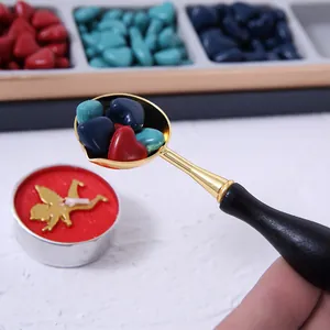 Retro heart-shaped sealing wax beads with gold melting spoon and cupid candle