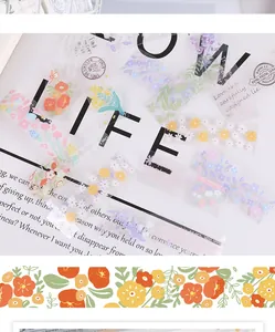 Close-up of decorative transparent PET floral stickers for journaling and DIY crafts