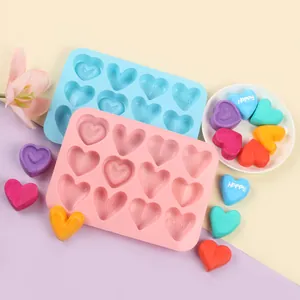Detail of 10-cavity heart silicone mold showing colorful heart chocolates and ice