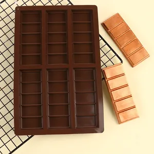 Detailed view of a 6-cavity brown silicone chocolate mold with finished bars