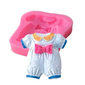 Detail view of pink silicone baby clothes mold with finished fondant onesie decoration