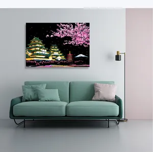Detailed view of city night scene scratch art hanging in a modern living room