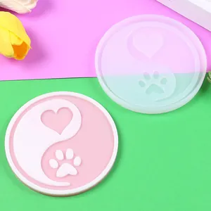 Close-up of heart and cat paw Yin Yang silicone mold for resin DIY coaster craft