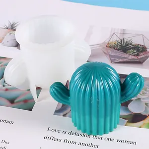 Detailed view showing a cactus silicone mold alongside a finished turquoise cactus candle.