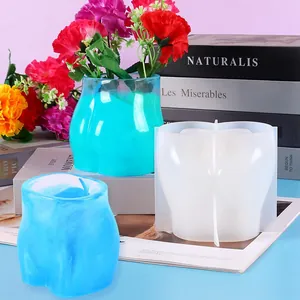 Detailed view of DIY silicone butt-shaped flower pot mold with resin samples