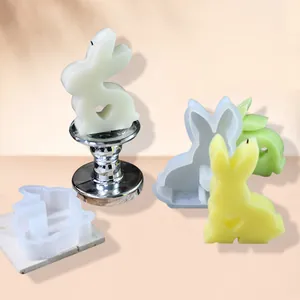 Detailed view of Easter bunny silicone molds and candles with heart-shaped cutouts