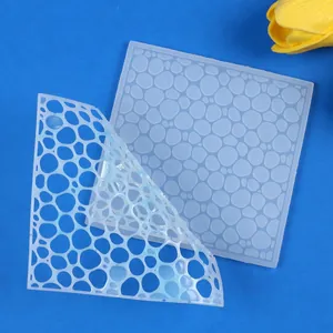 Detail view of ocean water ripple silicone mold showing flexibility for DIY coaster making.