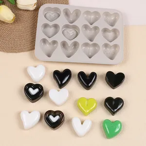 12-cavity heart-shaped silicone mold with colorful chocolate and ice samples.