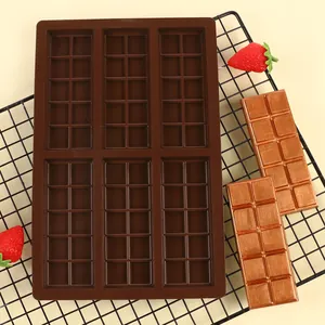Detailed view of a 6-cavity rectangular chocolate silicone mold with finished bars