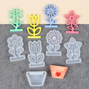 Set of DIY silicone molds for resin art featuring sunflower and tulip shapes with flower pot.