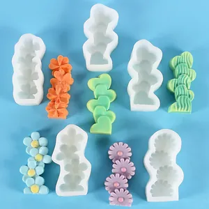 Detailed view of flower and heart shaped silicone molds for DIY resin and candle crafts