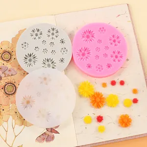 Detailed view of small daisy sunflower silicone molds with colorful resin flower samples