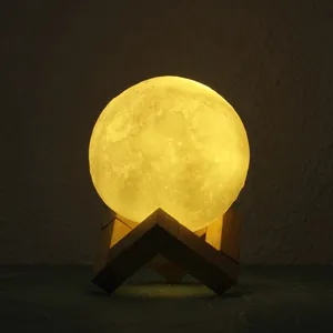 Creative 3D moon lamp with warm glow on geometric wooden stand for bedroom bedside