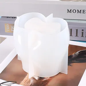 Close-up view of a translucent buttock-shaped silicone mold for DIY resin art crafts