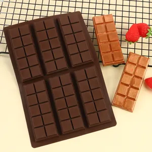 Detailed view of 6-cavity rectangular silicone chocolate mold with finished bar props