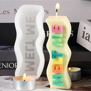 Close-up of wavy silicone candle mold and 'MELT ME' 3D letter aromatherapy candle.