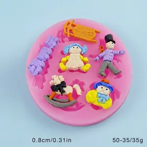 Detailed view of silicone mold showing rocking horse and doll figurines