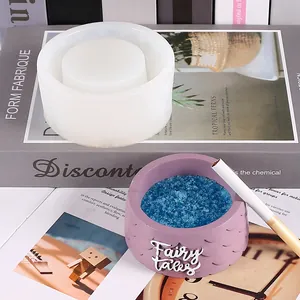 Detailed view of translucent silicone mold next to a finished purple DIY resin ashtray