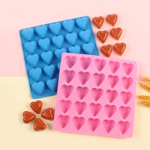 Heart-shaped silicone ice and chocolate mold set with 20 cavities each.