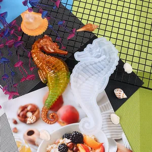 Close-up detail of a seahorse silicone mold and its colorful resin finished product