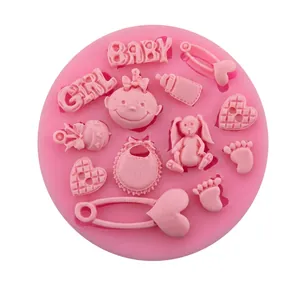 Close-up of pink silicone mold with baby girl, rabbit, and milk bottle patterns.