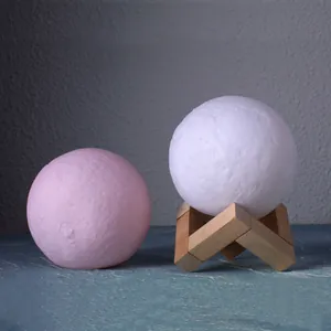 Creative 3D printed moon night light with crater texture and minimalist wooden stand