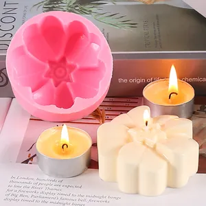 Detail view of pink flower silicone mold with finished cream-colored flower candle