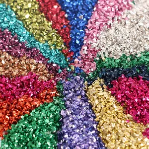 Detailed close-up view of multi-colored metallic crushed glass stones for DIY resin crafts