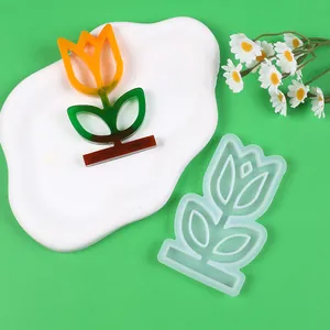 Detail of tulip flower pot silicone mold and finished colorful resin craft ornament