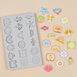 Detail view of vintage pattern silicone mold showing finished colorful fondant decorations