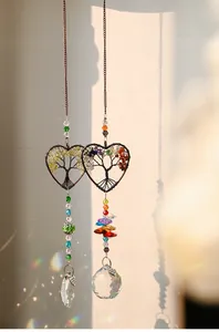 Detail view of heart-shaped Tree of Life suncatcher with rainbow crystal prism
