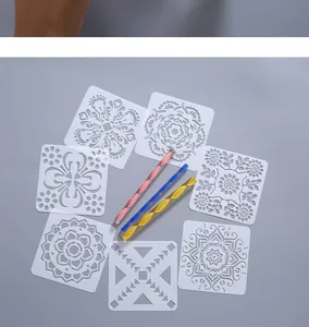 Detail view of white hollow mandala painting stencils and colorful dotting tools set