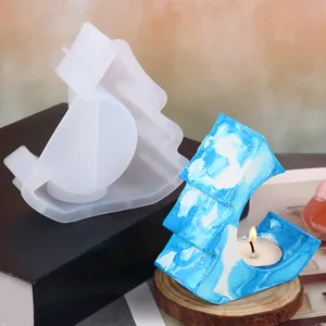 Detailed view of DIY Christmas tree house silicone mold and finished resin candle holder