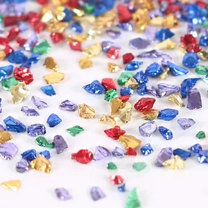 Macro detail of colorful crushed glass fragments for DIY resin crafts and nail art decor.