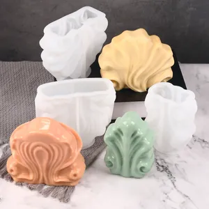 Professional shell-shaped silicone molds for candle making and resin crafts shown with finished items