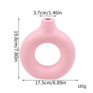 Detailed dimensions of a pink donut-shaped minimalist plastic vase for home decoration