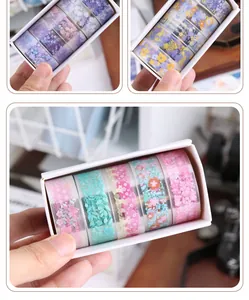 Detailed view of floral PET washi tape rolls in a white gift box for DIY crafts
