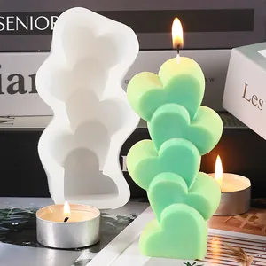Close-up detail of 5-linked heart silicone mold with finished light green candle