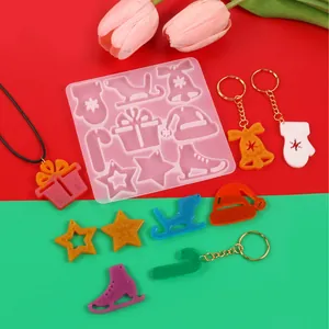 Christmas themed DIY resin silicone mold featuring bell star and hat shapes for creative keychains