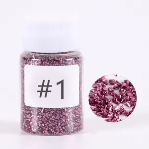 Close-up of rose red crushed glass stone filler in a bottle for resin DIY craft art
