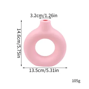 Detailed dimensions of pink donut-shaped decorative vase including height and weight