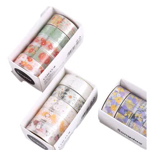 Detailed view of 3 boxes of transparent floral PET washi tapes for journaling set.