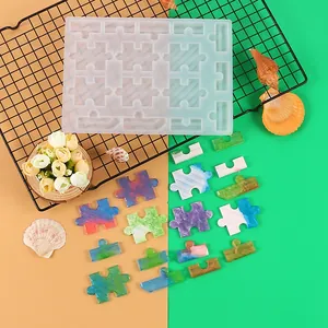 Translucent silicone puzzle mold for DIY resin crafts featuring colorful finished pieces