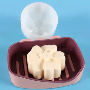 Detailed view of chrysanthemum flower silicone mold with finished white soap piece