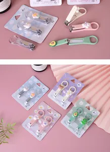 Variety of cute cartoon portable nail clippers in colorful blister pack packaging.