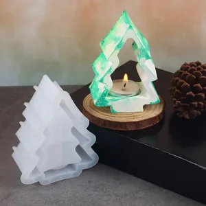 Comparison view of white silicone mold and marbled green Christmas tree candle holder
