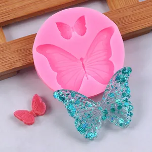 Butterfly silicone mold for resin or fondant showing detailed finished pieces.