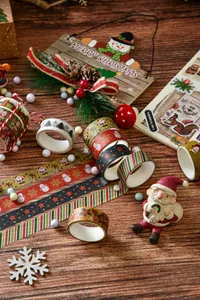 Detail shot of 6-roll Christmas washi tape set with festive Santa and snowflake patterns