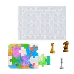 Detailed DIY resin puzzle mold with colorful finished pieces and metallic chess figures