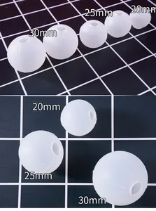 Detail of three sizes (20mm, 25mm, 30mm) spherical silicone molds for resin DIY
